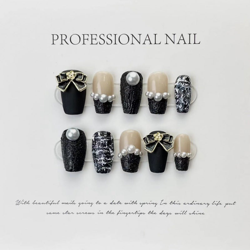 Classic Black Tweed with Glamorous Gold Bows – A Touch of Timeless Elegance